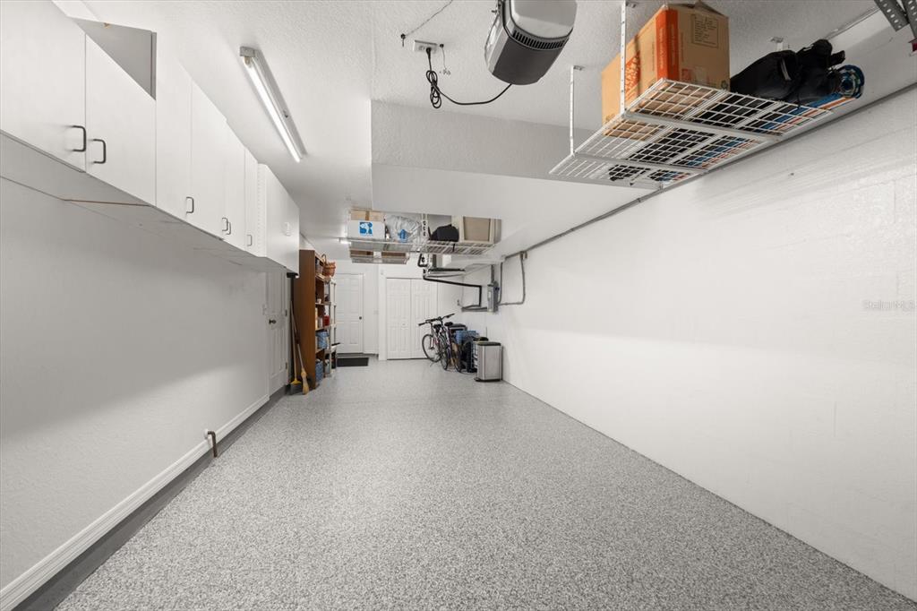 1206 Gulf Boulevard, Unit A6 Indian Rocks Beach, FL 33785 - Photo 45 of 61 a view of storage and utility room with stairs