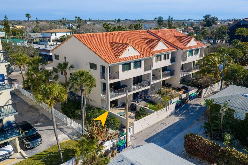 1206 Gulf Boulevard, Unit A6 Indian Rocks Beach, FL 33785 - Photo 47 of 61 an aerial view of a houses with yard