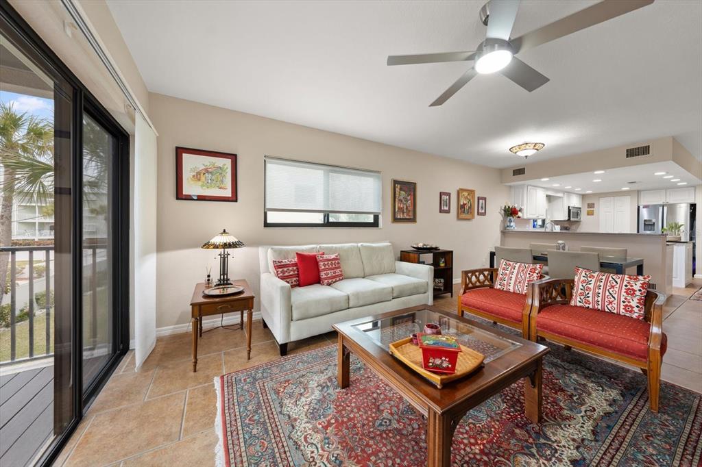 1206 Gulf Boulevard, Unit A6 Indian Rocks Beach, FL 33785 - Photo 5 of 61 a living room with furniture and a rug