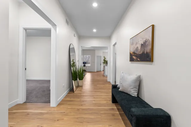 a bathroom with a sink mirror toilet and vanity