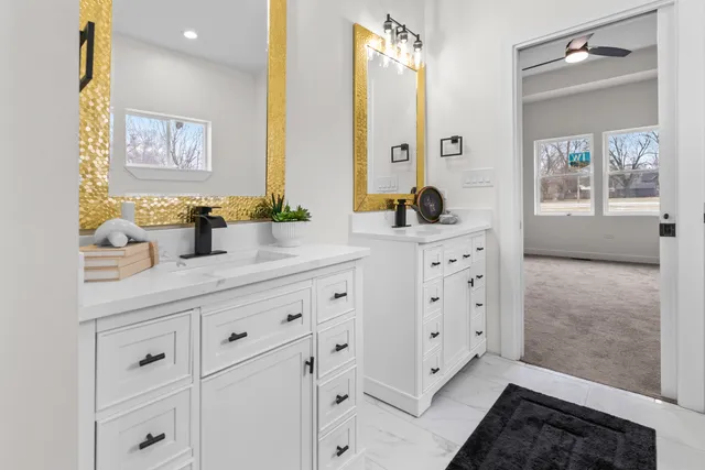 a bathroom with a glass shower door