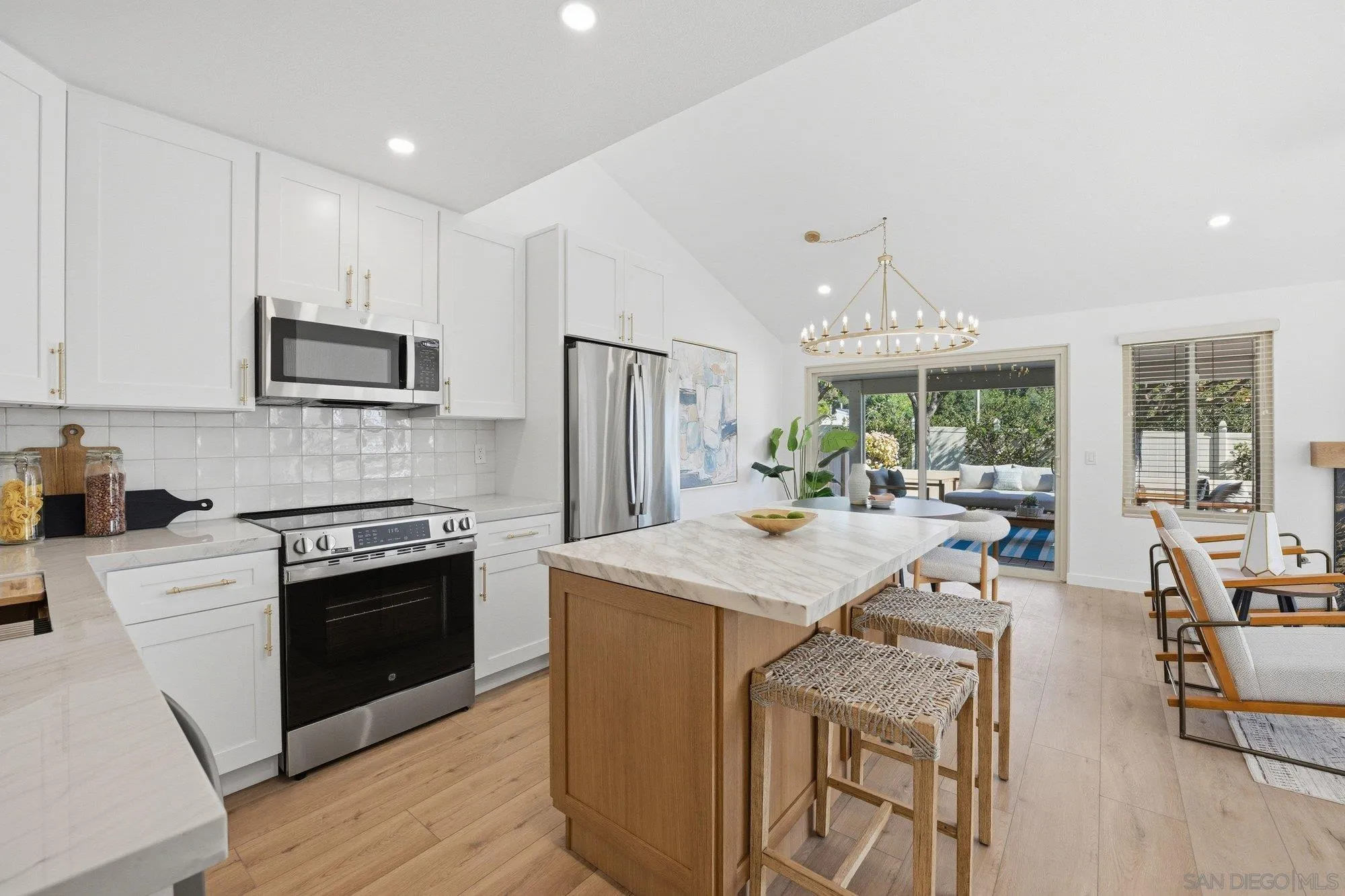1926 Springdale Lane Encinitas, CA 92024 - Photo 13 of 28 a open kitchen with stainless steel appliances granite countertop a stove refrigerator and a sink