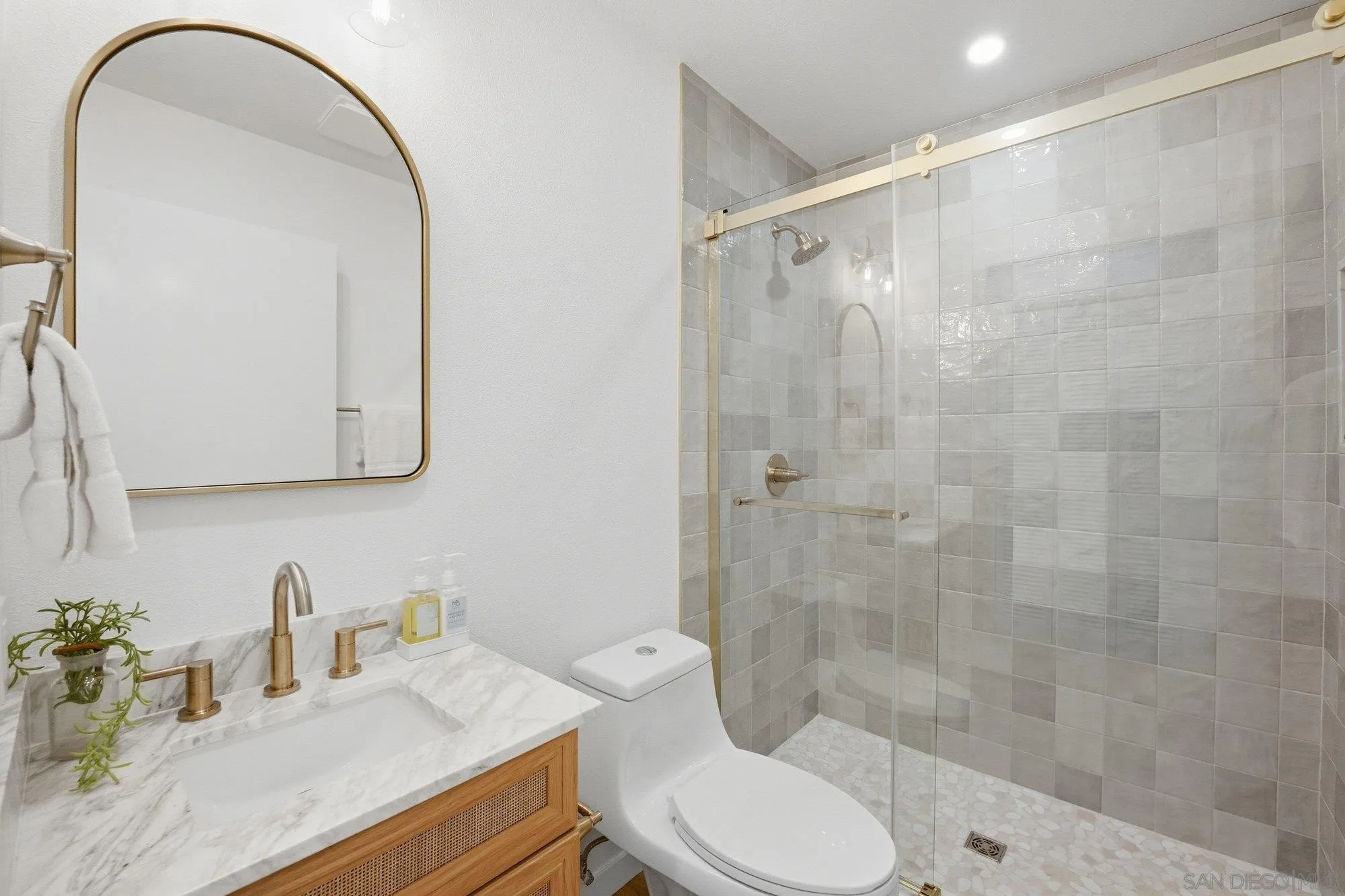 1926 Springdale Lane Encinitas, CA 92024 - Photo 14 of 28 a bathroom with a sink toilet and shower