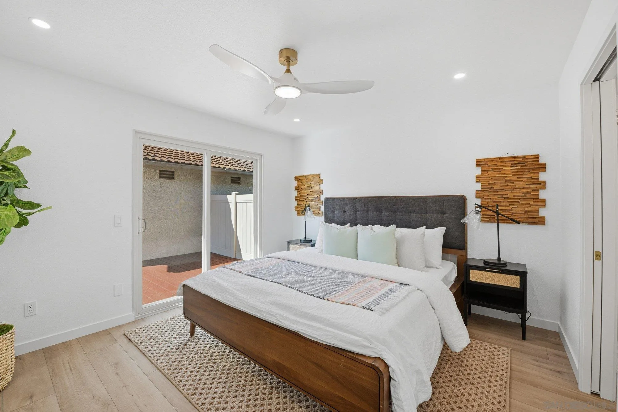 1926 Springdale Lane Encinitas, CA 92024 - Photo 15 of 28 a bedroom with a bed and a lamp