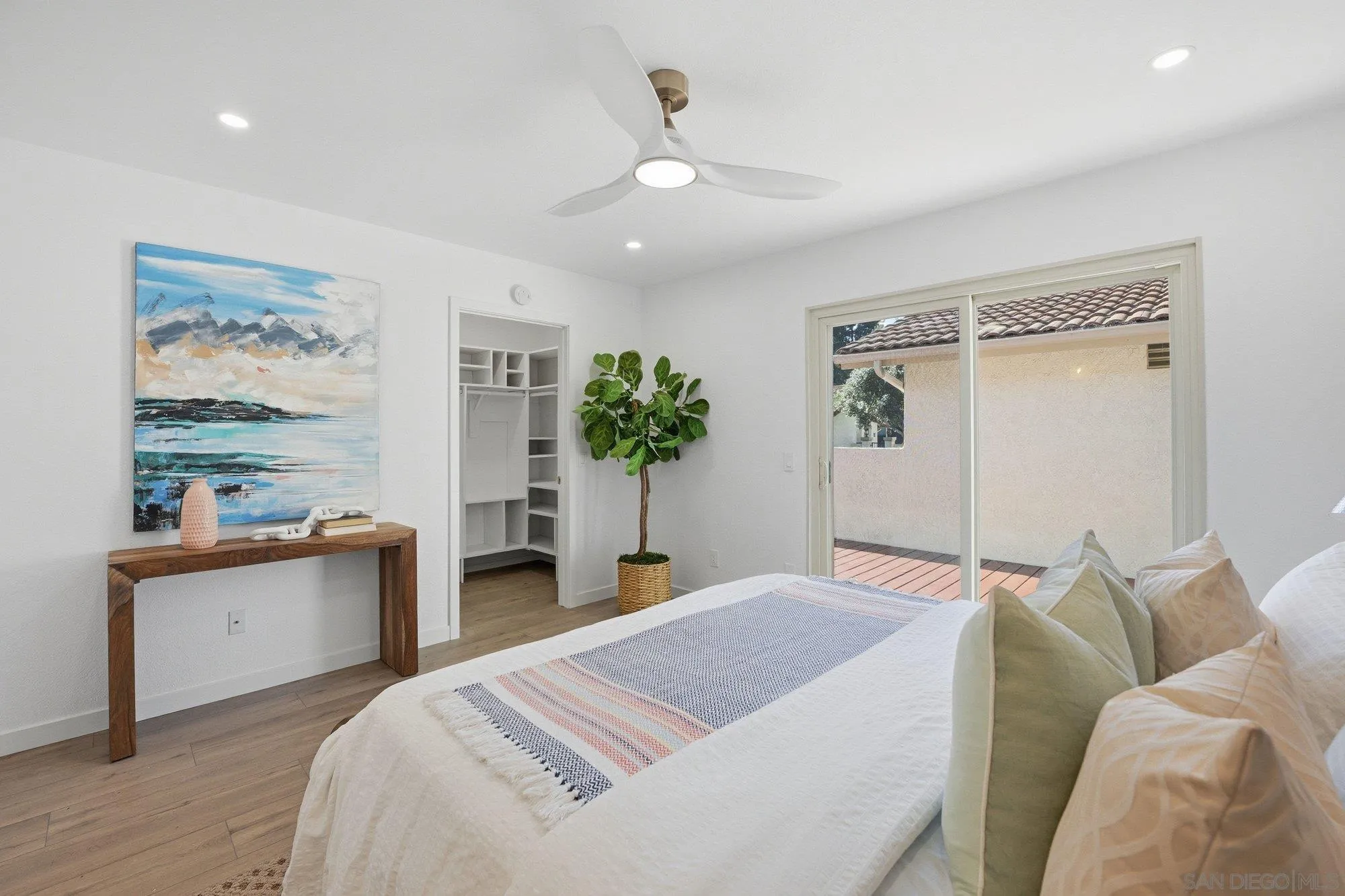 1926 Springdale Lane Encinitas, CA 92024 - Photo 17 of 28 a bedroom with a bed and a chandelier