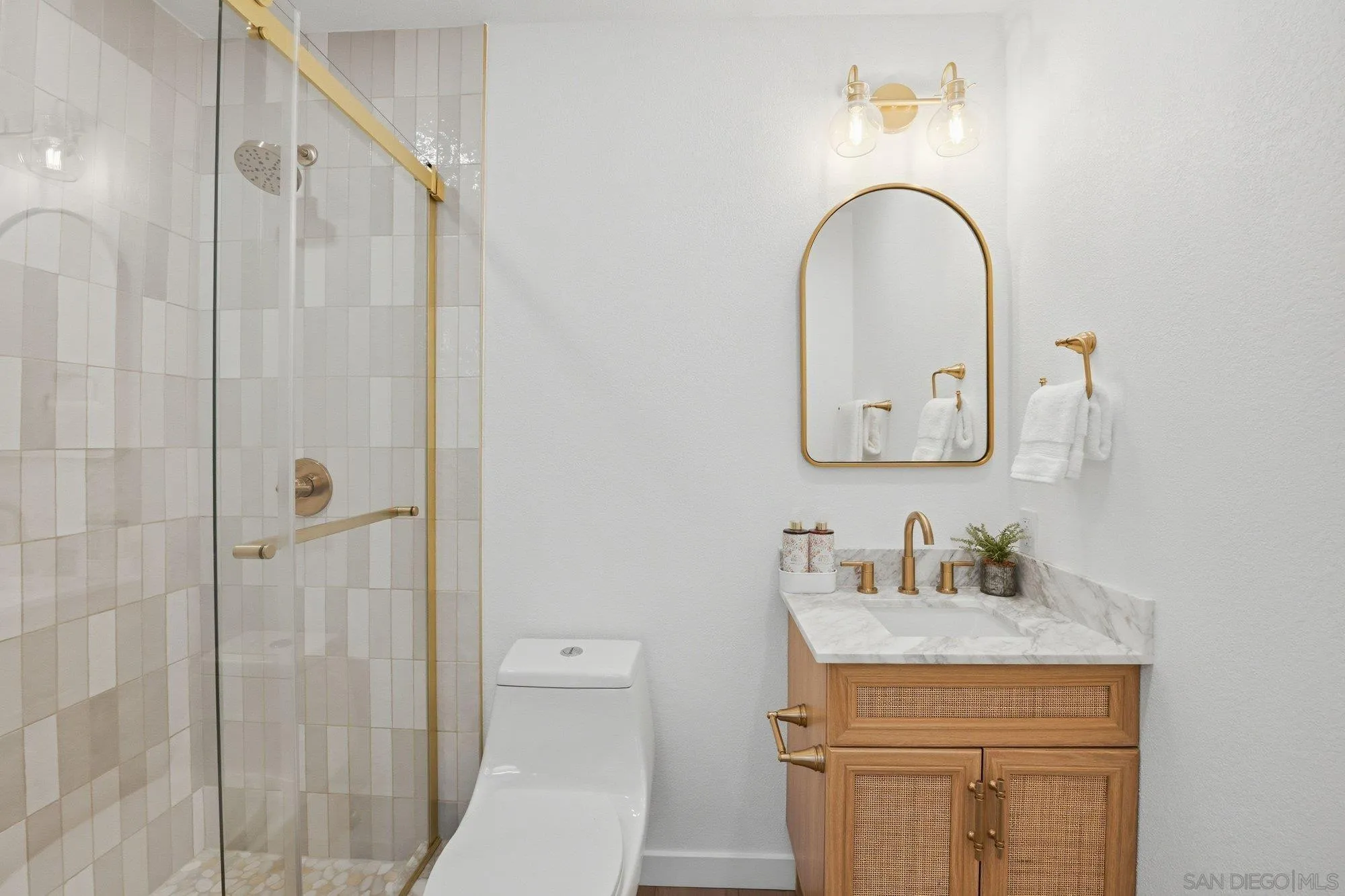 1926 Springdale Lane Encinitas, CA 92024 - Photo 18 of 28 a bathroom with a sink a toilet and shower