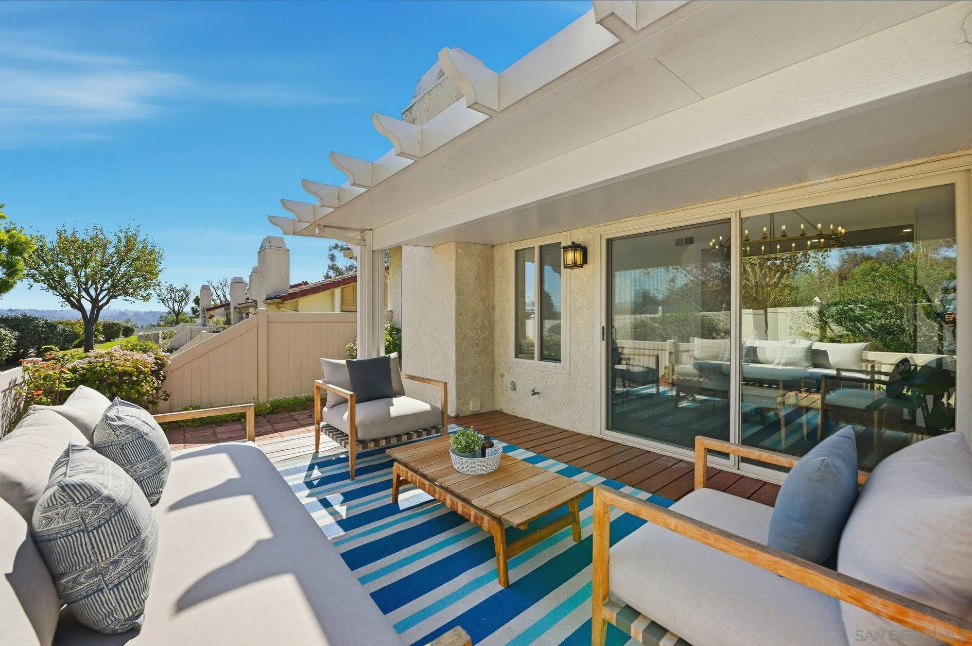 1926 Springdale Lane Encinitas, CA 92024 - Photo 10 of 28 a living room with furniture and a floor to ceiling window