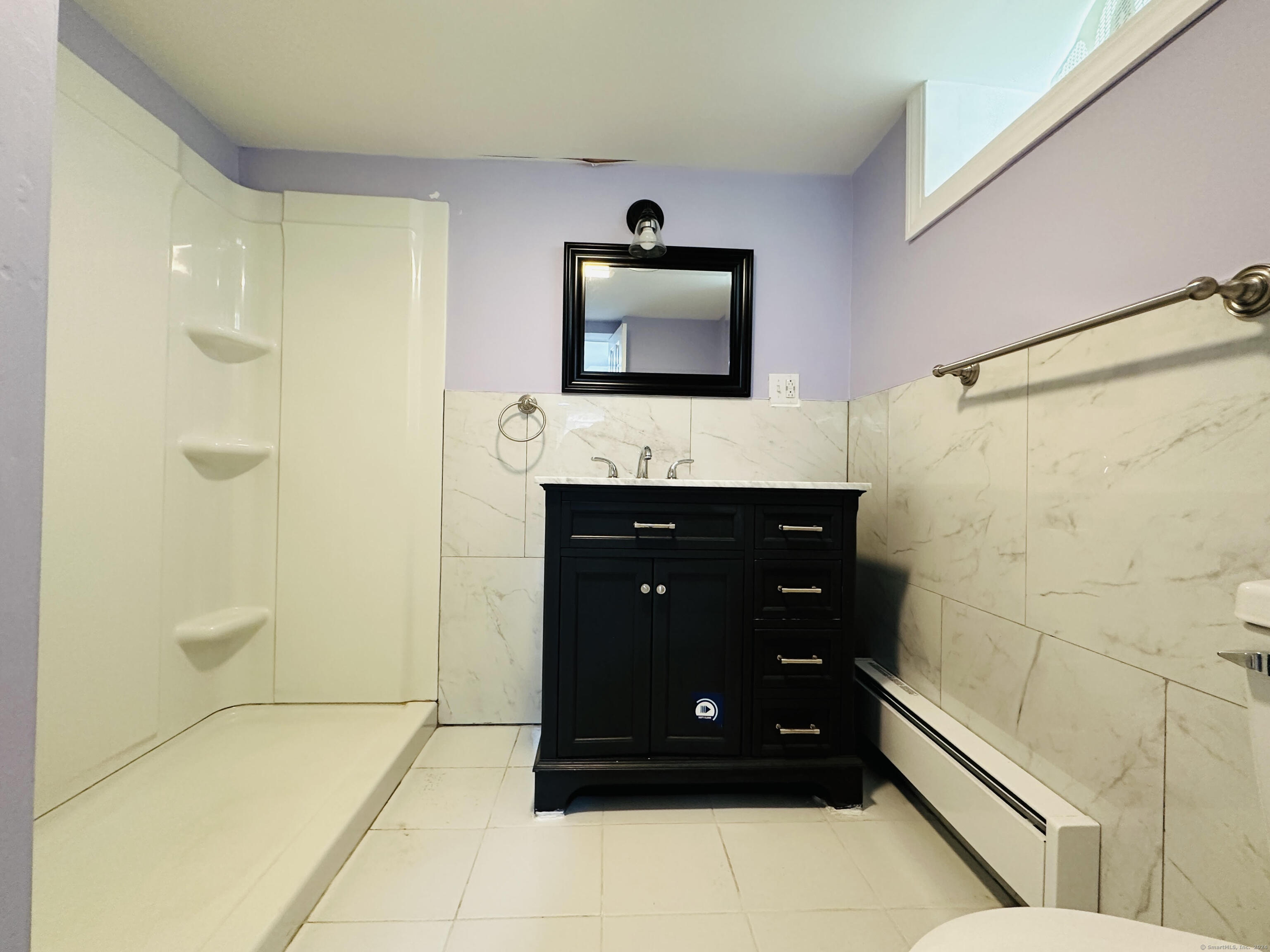 31 Brainerd Road Branford, CT 06405 - Photo 11 of 15 a bathroom with a sink a shower and a mirror