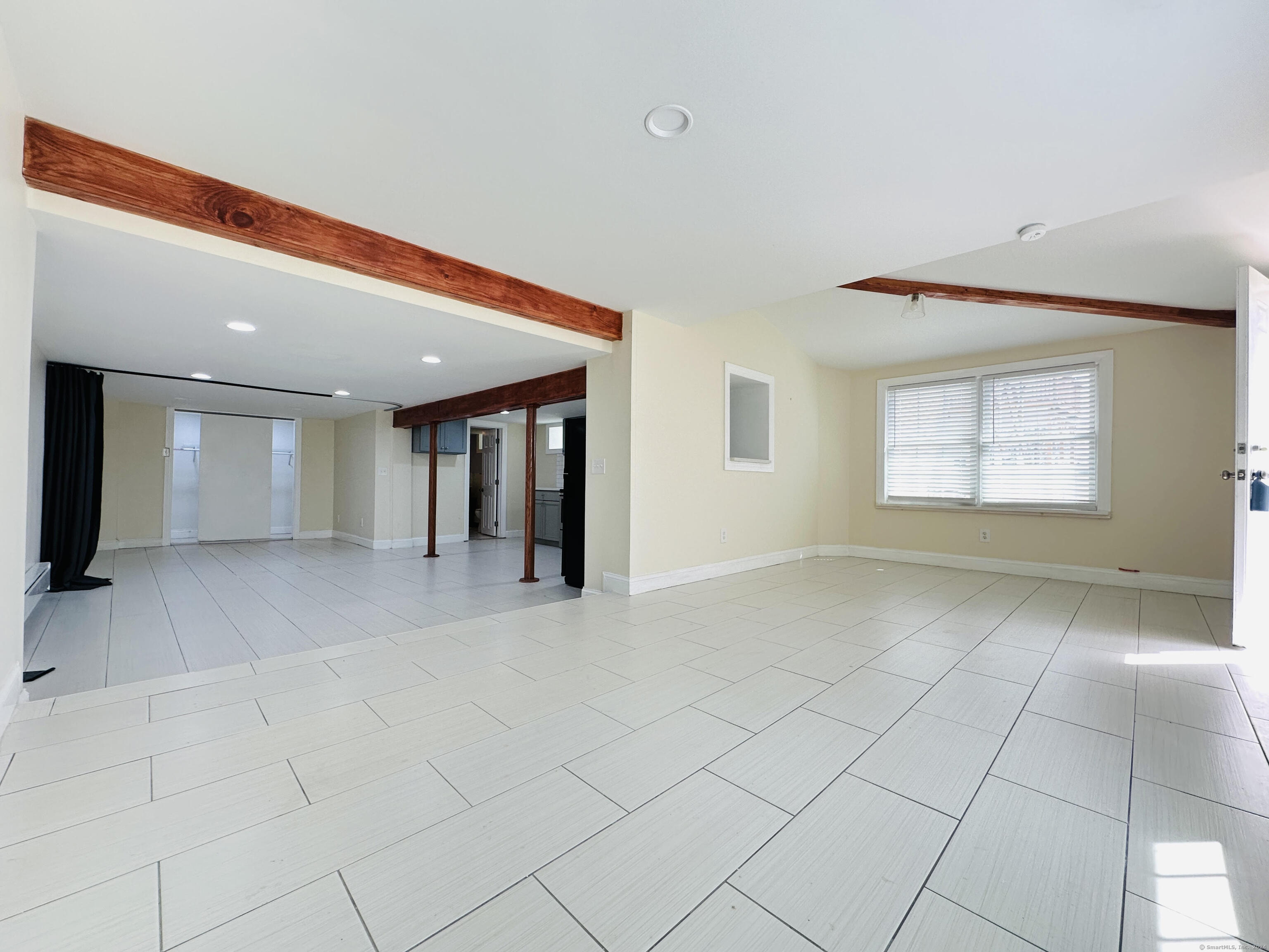 31 Brainerd Road Branford, CT 06405 - Photo 3 of 15 a view of an empty room and window