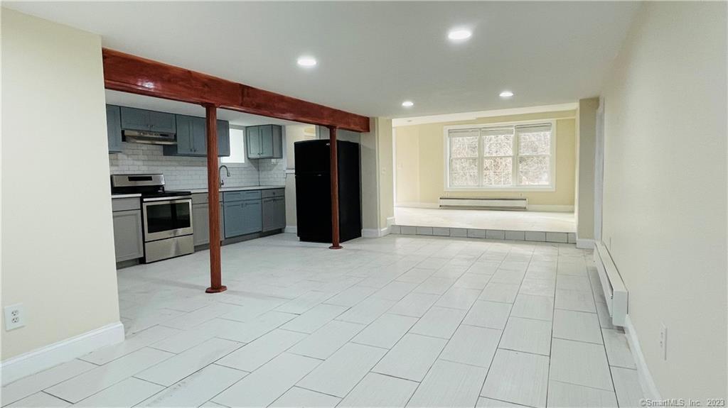 31 Brainerd Road Branford, CT 06405 - Photo 6 of 15 a view of a kitchen with a sink and a refrigerator