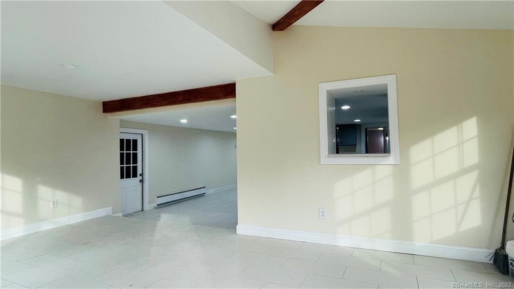 31 Brainerd Road Branford, CT 06405 - Photo 6 of 14 view when opening the door, cutout looks into kitchen