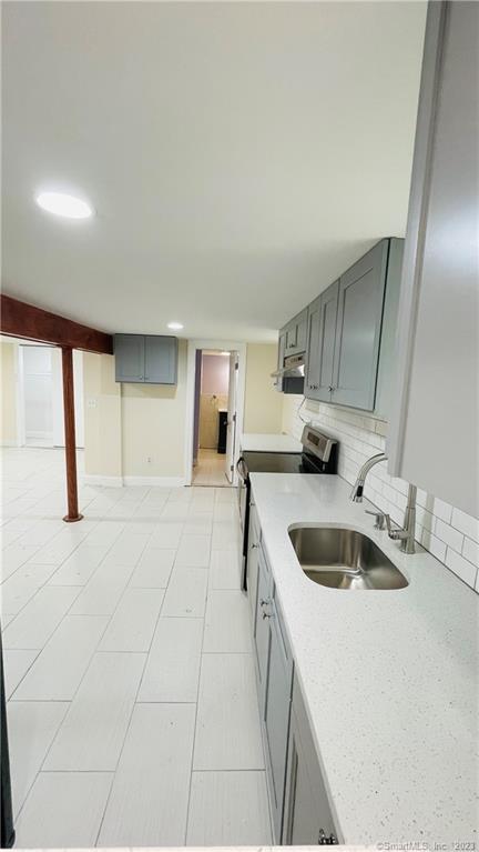 31 Brainerd Road Branford, CT 06405 - Photo 8 of 14 view of kitchen and bathroom from cutout in wall