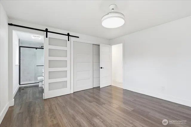 a bathroom with a shower and a sink