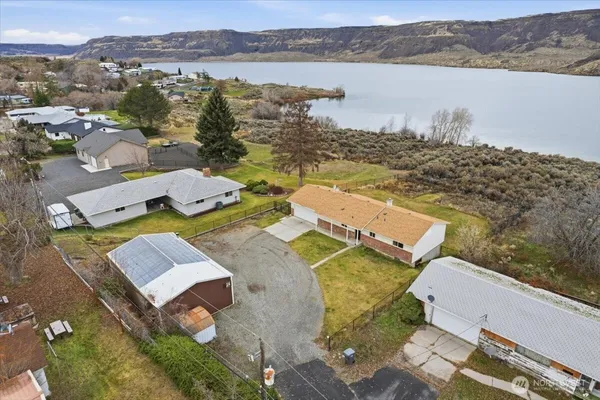 an aerial view of a house with a lake view