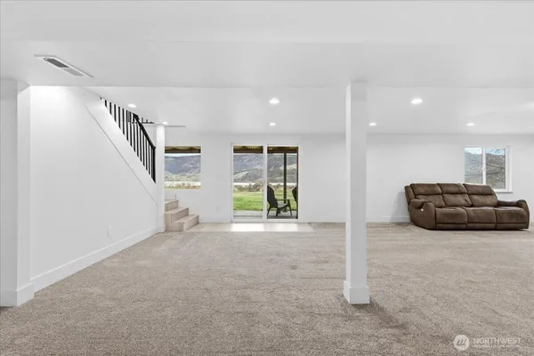 a view of livingroom with furniture and stairs