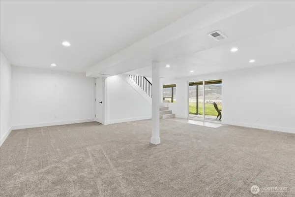 a view of a livingroom with a staircase