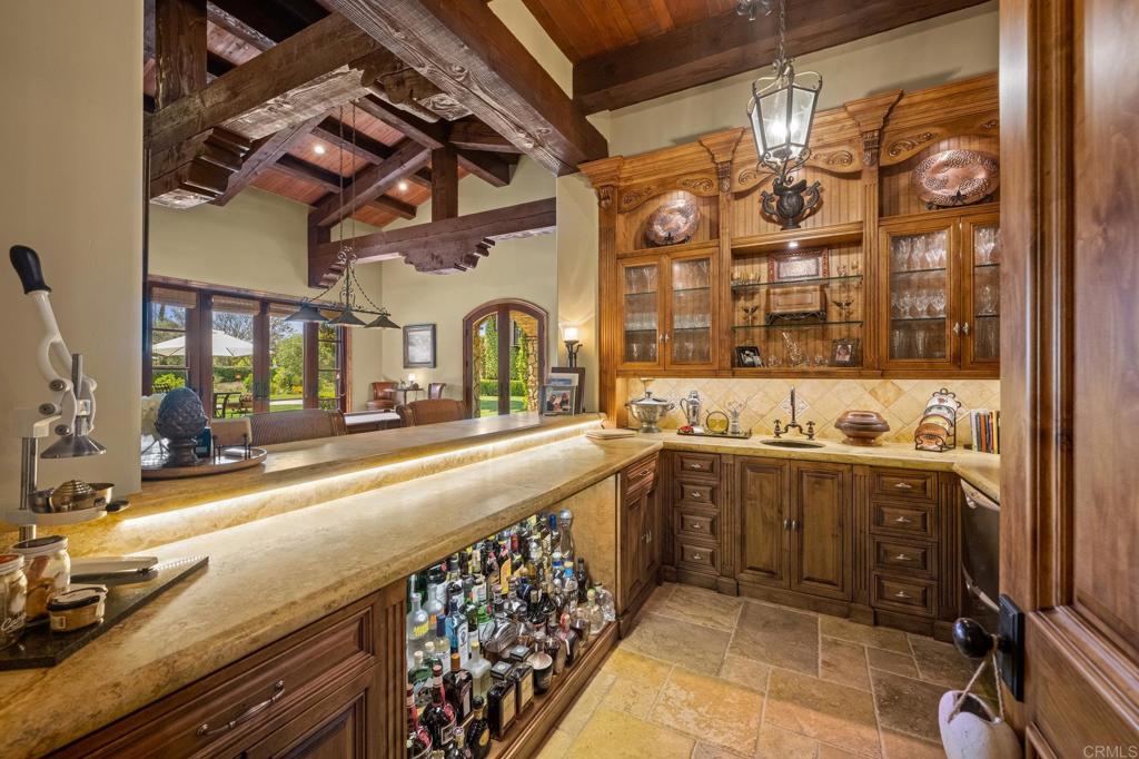 6314 El Apajo Rancho Santa Fe, CA 92067 - Photo 17 of 60 a large kitchen with a sink and cabinets