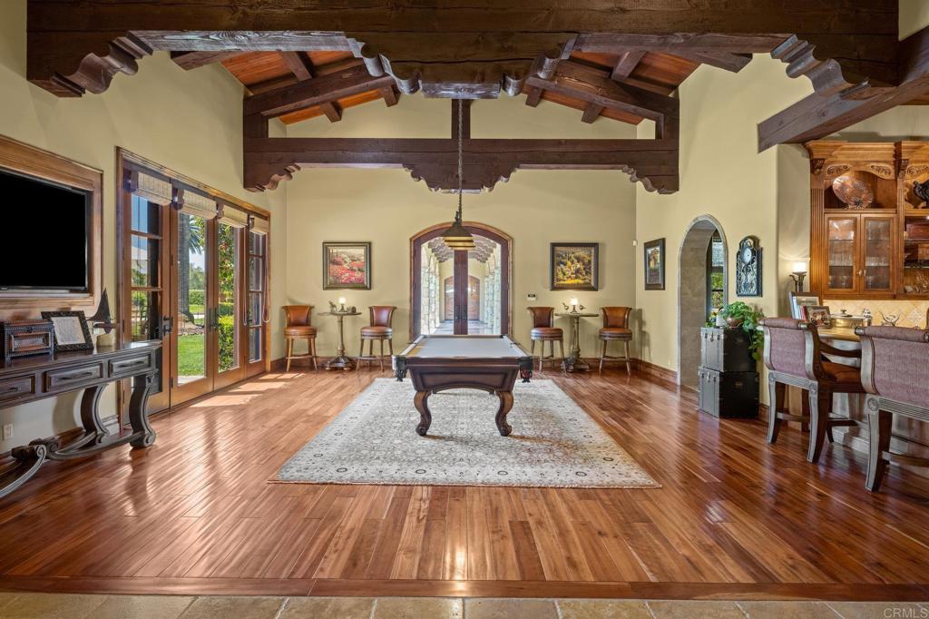 6314 El Apajo Rancho Santa Fe, CA 92067 - Photo 18 of 60 a living room with furniture dining table and a flat screen tv
