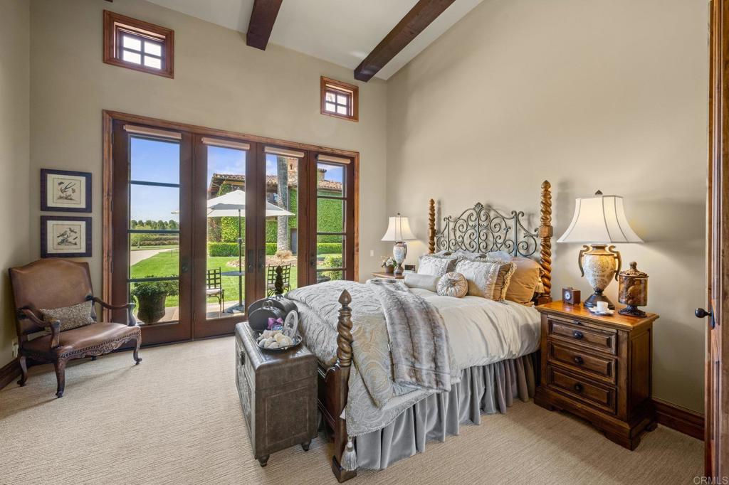 6314 El Apajo Rancho Santa Fe, CA 92067 - Photo 22 of 60 a bedroom with a bed and a couch