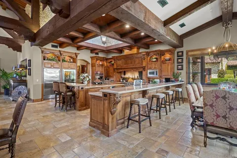 a kitchen with stainless steel appliances granite countertop a stove and a sink
