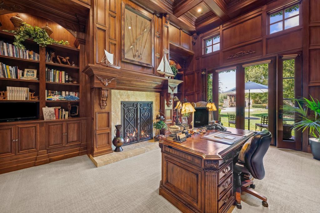 6314 El Apajo Rancho Santa Fe, CA 92067 - Photo 32 of 60 a view of a livingroom with furniture and a fireplace