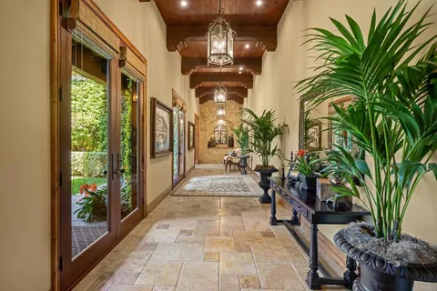 a living room with furniture and a book shelf