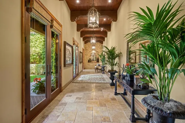 a living room with furniture and a book shelf