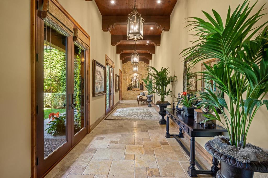 6314 El Apajo Rancho Santa Fe, CA 92067 - Photo 34 of 60 a lobby with furniture and a potted plant