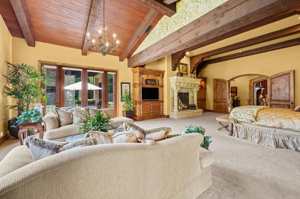 6314 El Apajo Rancho Santa Fe, CA 92067 - Photo 37 of 60 a living room with furniture and a chandelier
