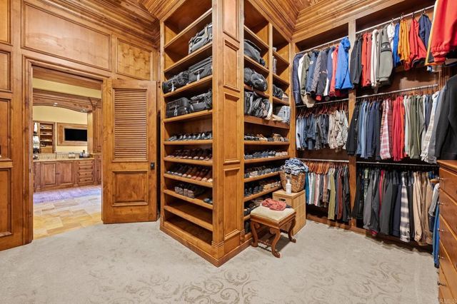 a kitchen with granite countertop a refrigerator and a sink