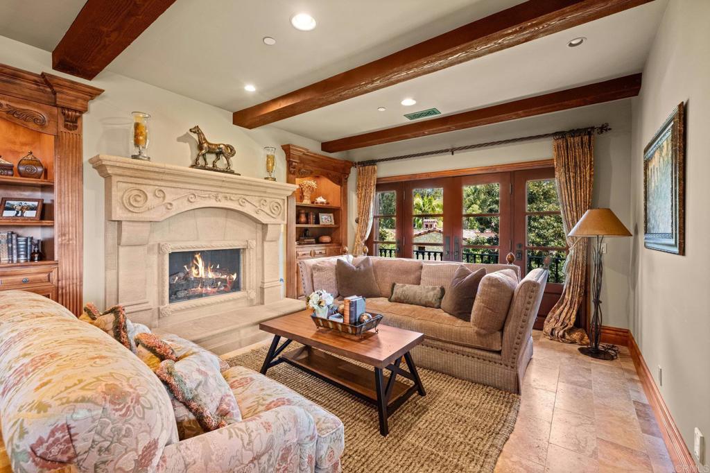 6314 El Apajo Rancho Santa Fe, CA 92067 - Photo 45 of 60 a living room with furniture and a fireplace