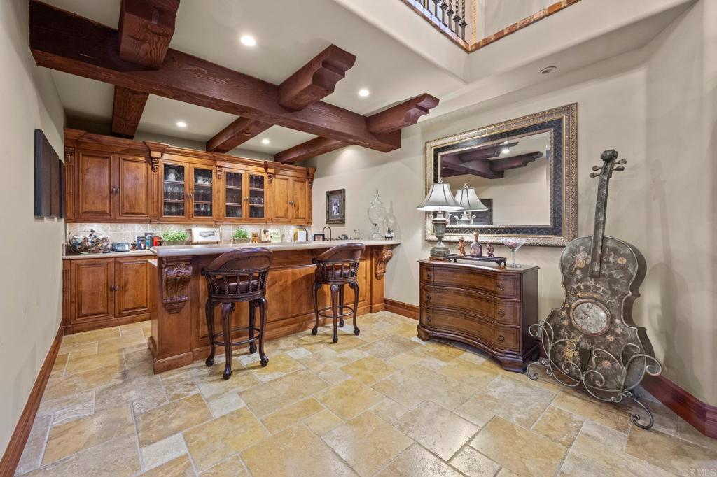 6314 El Apajo Rancho Santa Fe, CA 92067 - Photo 52 of 60 a view of a kitchen with stainless steel appliances kitchen island granite countertop a stove and a sink