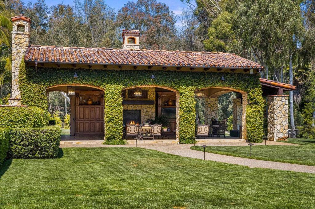 6314 El Apajo Rancho Santa Fe, CA 92067 - Photo 53 of 60 a view of a house with garden and plants