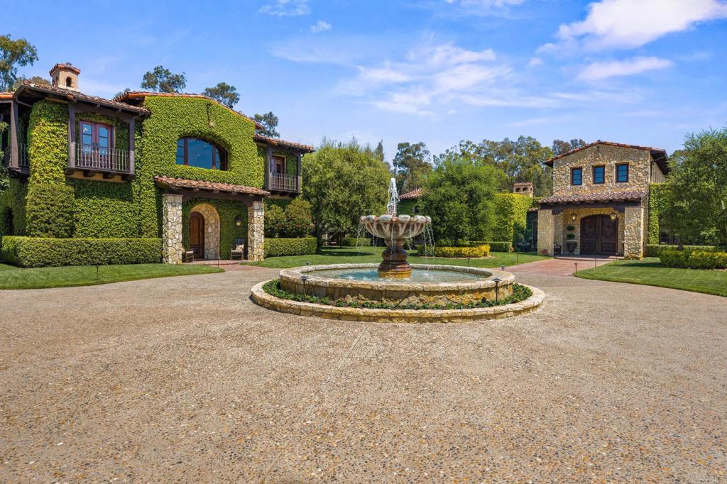 6314 El Apajo Rancho Santa Fe, CA 92067 - Photo 6 of 60 a front view of a house with a yard