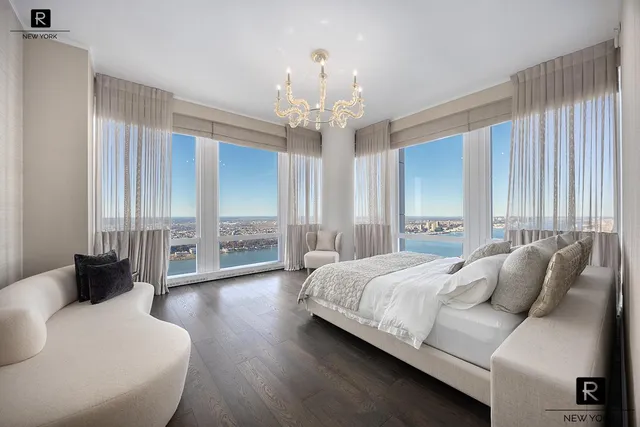 a bedroom with bed and window