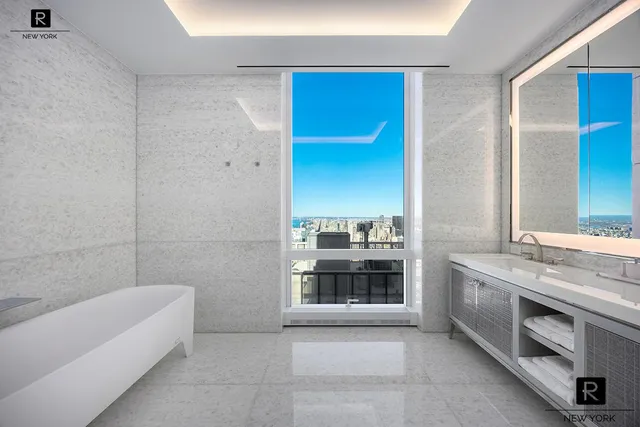a bathroom with a double vanity sink a tub and shower
