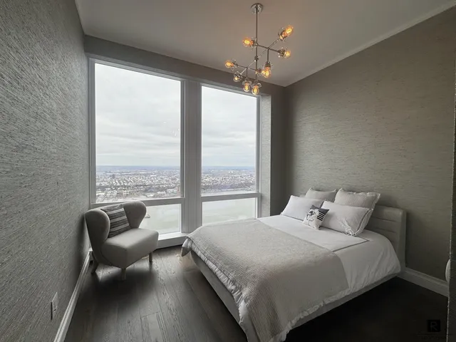 a bedroom with a bed and a balcony