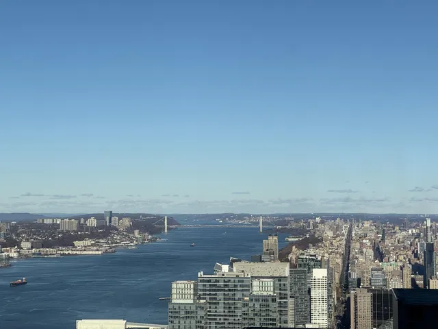 a view of ocean with a multi story building