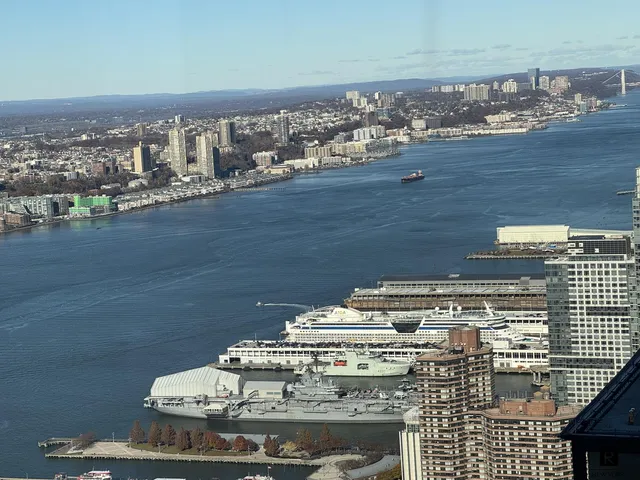 a view of roof deck with city view and ocean view