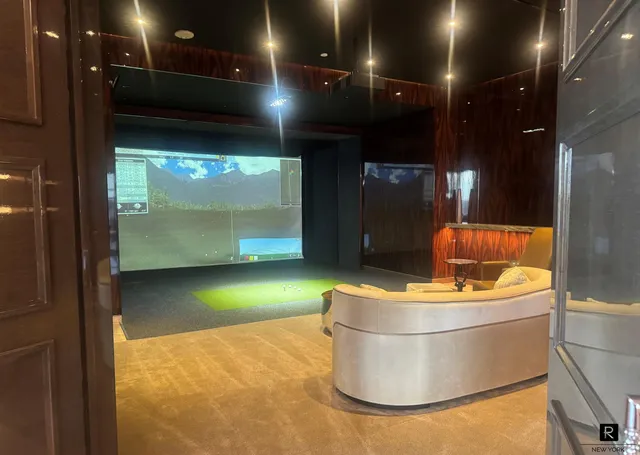 a room with water heater and a projector screen