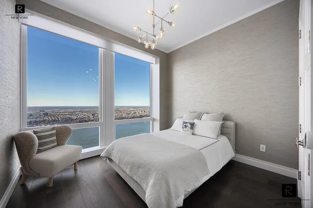 a bedroom with a large bed and a couch