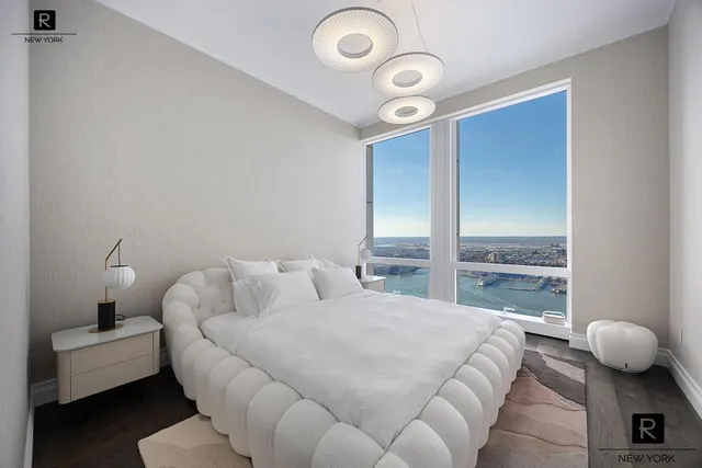 a bedroom with bed and window