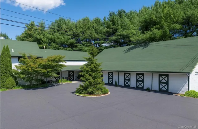 front view of a house with potted plants
