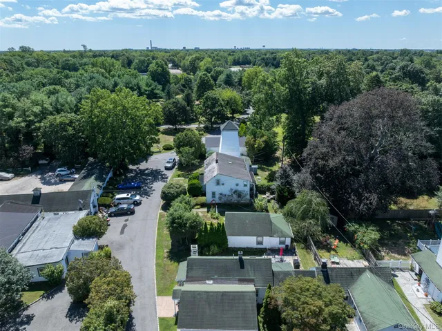 an aerial view of a house with a garden