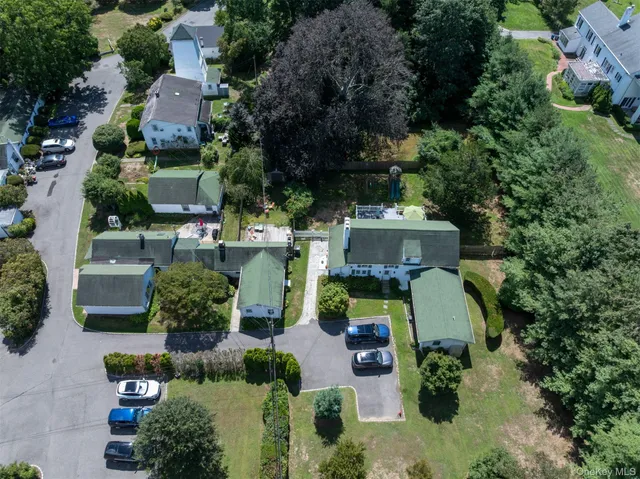 an aerial view of a house with outdoor space