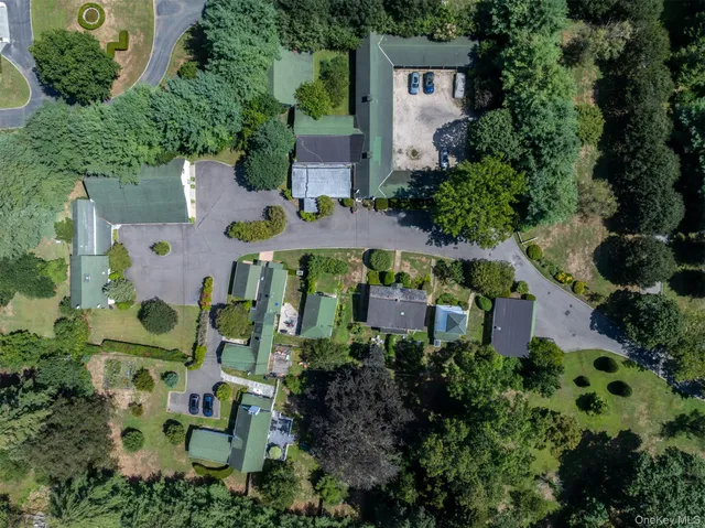 an aerial view of multiple houses with outdoor space