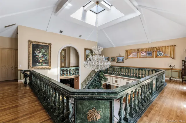 a view of entryway livingroom and hall with wooden floor