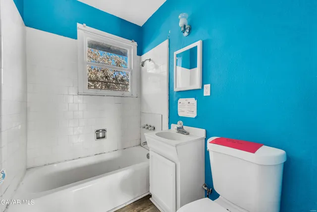 a bathroom with a sink and toilet