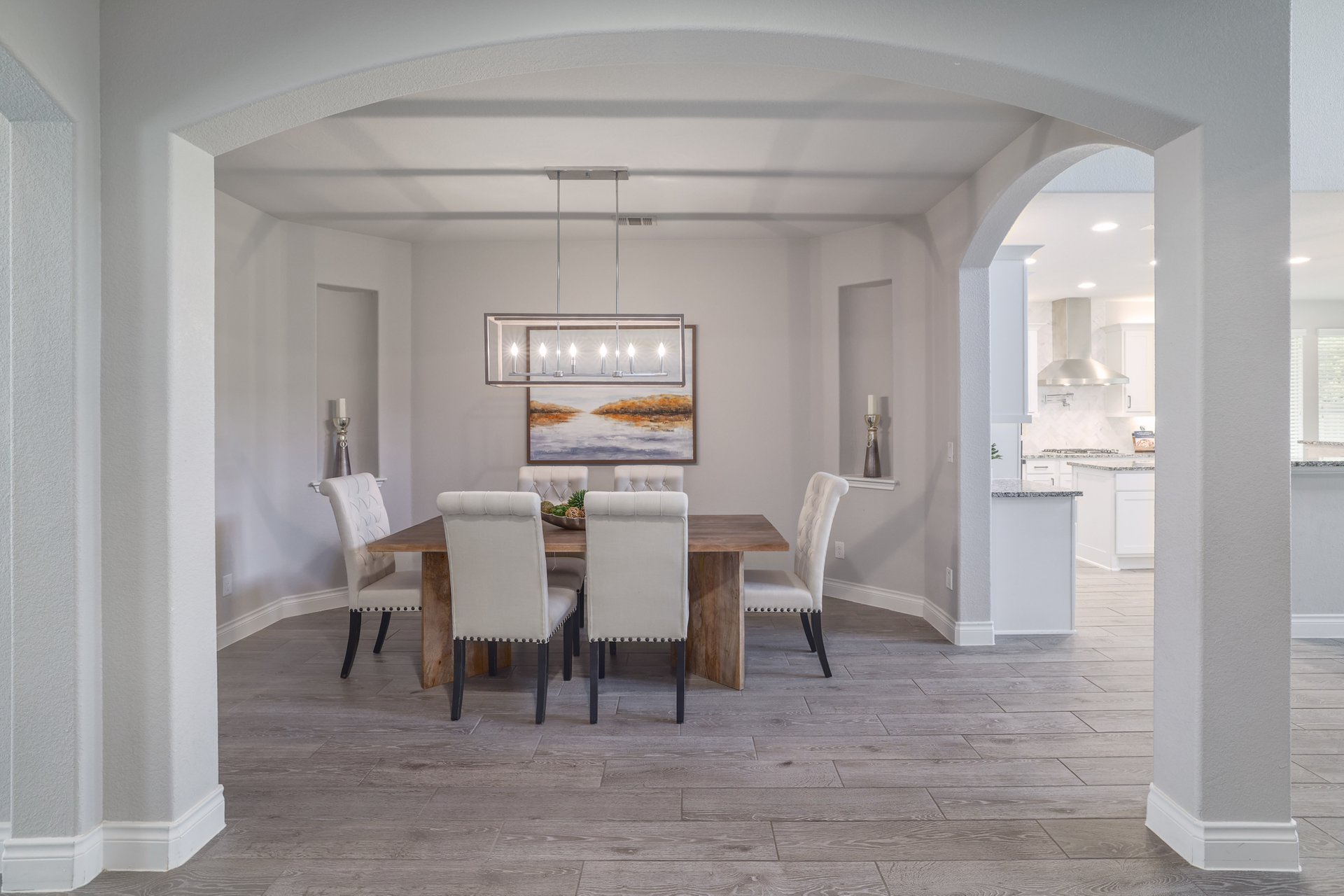 1513 Lakeside Ranch Road Georgetown, TX 78633 - Photo 20 of 40 Dining area featuring light wood finished floors, arched walkways, and recessed lighting