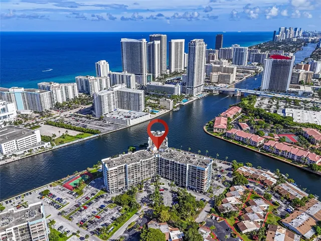 a room with furniture pool table and window